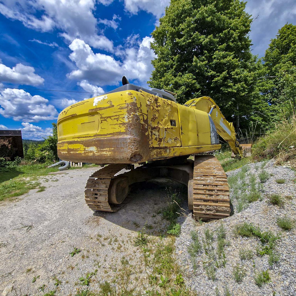 New Holland Kobelco E215 - Bager gusjeničar: slika New Holland Kobelco E215 - Bager gusjeničar New Holland Kobelco E215 - Bager gusjeničar: slika New Holland Kobelco E215 - Bager gusjeničar