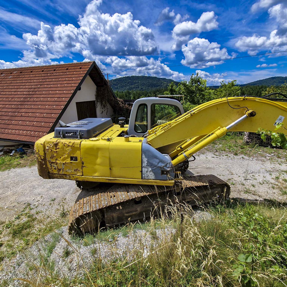 New Holland Kobelco E215 - Bager gusjeničar: slika New Holland Kobelco E215 - Bager gusjeničar New Holland Kobelco E215 - Bager gusjeničar: slika New Holland Kobelco E215 - Bager gusjeničar