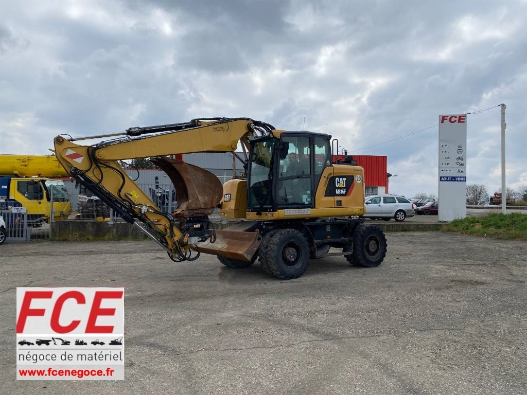 CAT M 315F /1er Main-Certificat CE Non accidenté - Bager na kotačima: slika CAT M 315F /1er Main-Certificat CE Non accidenté - Bager na kotačima CAT M 315F /1er Main-Certificat CE Non accidenté - Bager na kotačima: slika CAT M 315F /1er Main-Certificat CE Non accidenté - Bager na kotačima