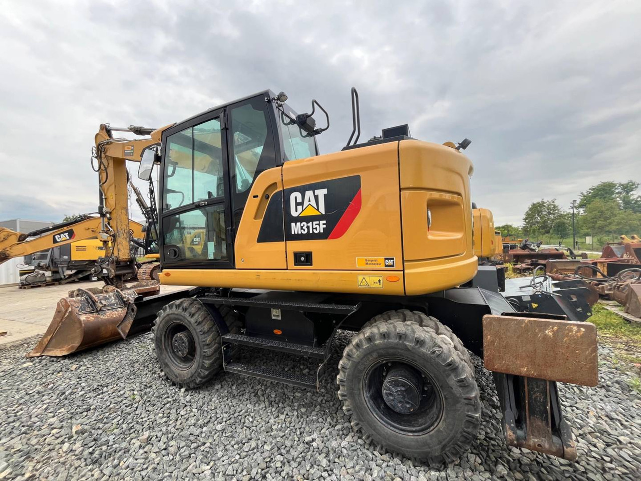 CAT M315F - Bager na kotačima: slika CAT M315F - Bager na kotačima CAT M315F - Bager na kotačima: slika CAT M315F - Bager na kotačima