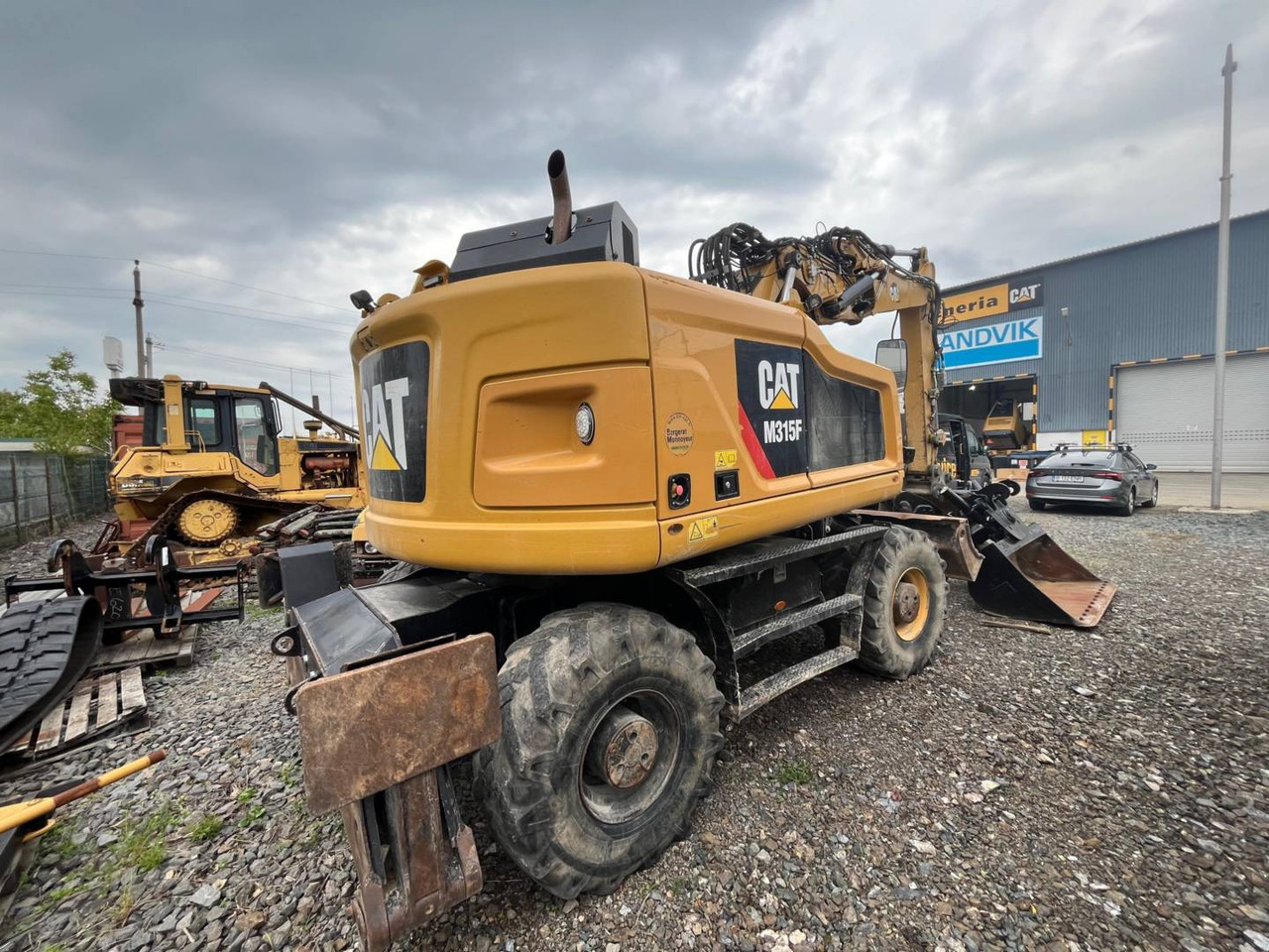 CAT M315F - Bager na kotačima: slika CAT M315F - Bager na kotačima CAT M315F - Bager na kotačima: slika CAT M315F - Bager na kotačima