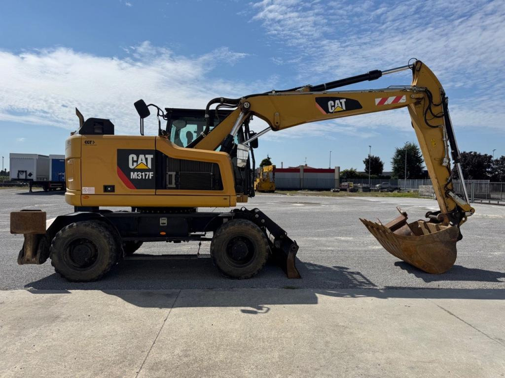 Caterpillar M317F - Bager na kotačima: slika Caterpillar M317F - Bager na kotačima Caterpillar M317F - Bager na kotačima: slika Caterpillar M317F - Bager na kotačima