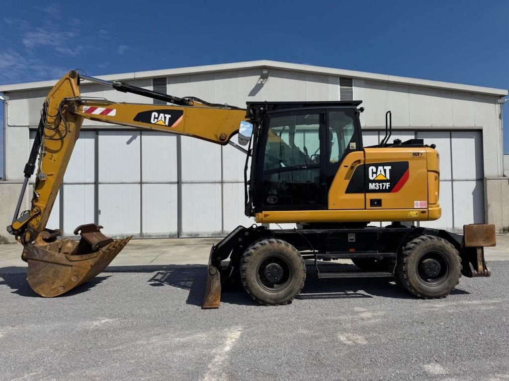 Caterpillar M317F - Bager na kotačima: slika Caterpillar M317F - Bager na kotačima Caterpillar M317F - Bager na kotačima: slika Caterpillar M317F - Bager na kotačima
