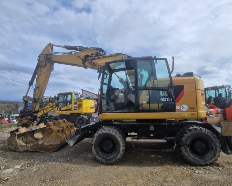 Caterpillar M315F F - Bager na kotačima: slika Caterpillar M315F F - Bager na kotačima Caterpillar M315F F - Bager na kotačima: slika Caterpillar M315F F - Bager na kotačima