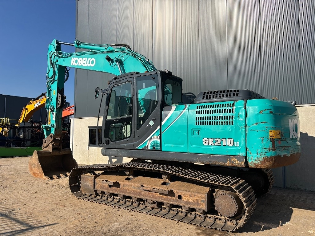Kobelco SK 210 LC-10 - Kobelco SK210 - Bager gusjeničar: slika Kobelco SK 210 LC-10 - Kobelco SK210 - Bager gusjeničar Kobelco SK 210 LC-10 - Kobelco SK210 - Bager gusjeničar: slika Kobelco SK 210 LC-10 - Kobelco SK210 - Bager gusjeničar