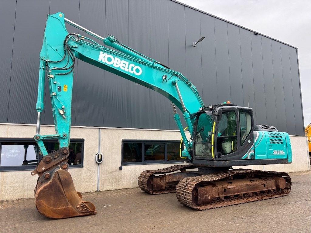 Kobelco SK 210 LC-10 - Bager gusjeničar: slika Kobelco SK 210 LC-10 - Bager gusjeničar Kobelco SK 210 LC-10 - Bager gusjeničar: slika Kobelco SK 210 LC-10 - Bager gusjeničar
