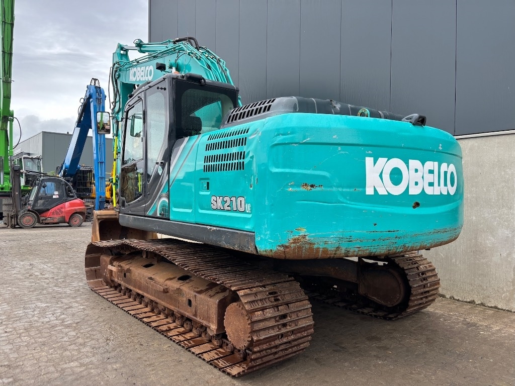 Kobelco SK 210 LC-10 - Bager gusjeničar: slika Kobelco SK 210 LC-10 - Bager gusjeničar Kobelco SK 210 LC-10 - Bager gusjeničar: slika Kobelco SK 210 LC-10 - Bager gusjeničar