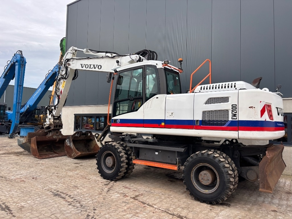 Volvo EW 210 D - EW210 - EW210D - EW 180 - EW 240 - Bager na kotačima: slika Volvo EW 210 D - EW210 - EW210D - EW 180 - EW 240 - Bager na kotačima Volvo EW 210 D - EW210 - EW210D - EW 180 - EW 240 - Bager na kotačima: slika Volvo EW 210 D - EW210 - EW210D - EW 180 - EW 240 - Bager na kotačima