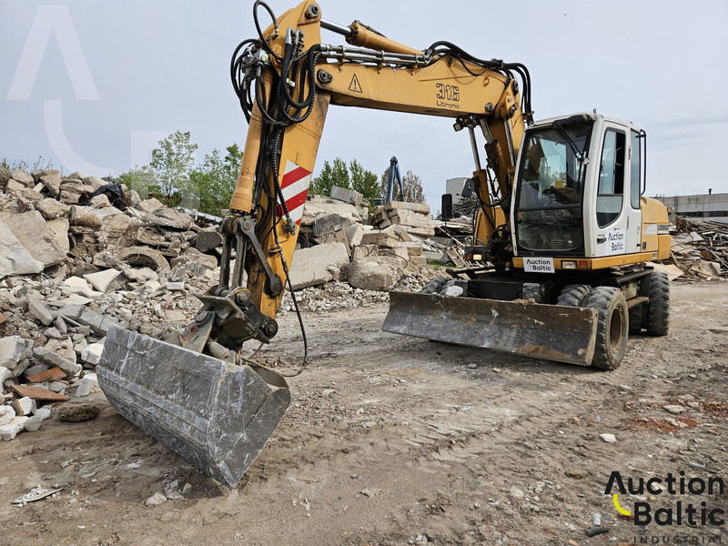 Liebherr A 316 Litronic - Bager na kotačima: slika Liebherr A 316 Litronic - Bager na kotačima Liebherr A 316 Litronic - Bager na kotačima: slika Liebherr A 316 Litronic - Bager na kotačima