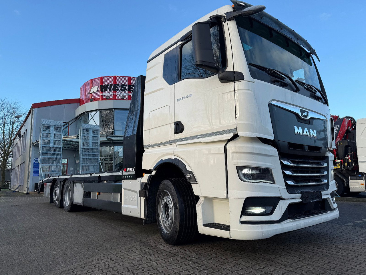 MAN Baumaschinen-  Arbeitsbühnentransporter Rampen - Kamion s otvorenim sandukom: slika  MAN Baumaschinen-  Arbeitsbühnentransporter Rampen - Kamion s otvorenim sandukom MAN Baumaschinen-  Arbeitsbühnentransporter Rampen - Kamion s otvorenim sandukom: slika  MAN Baumaschinen-  Arbeitsbühnentransporter Rampen - Kamion s otvorenim sandukom