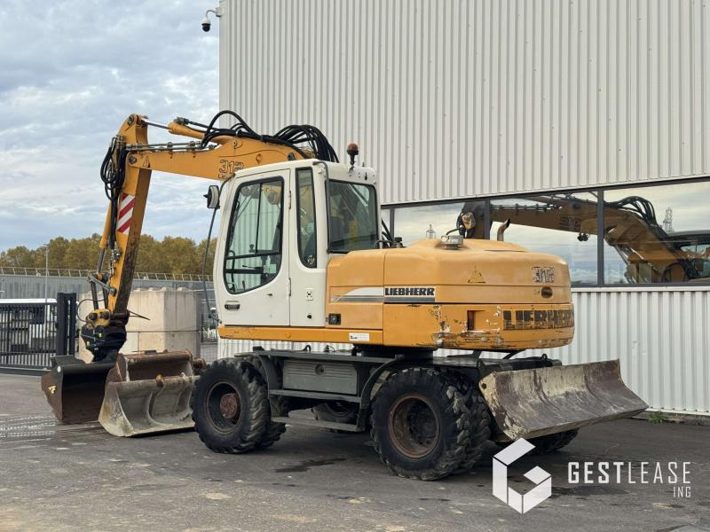 Liebherr A312 Litronic - Bager na kotačima: slika Liebherr A312 Litronic - Bager na kotačima Liebherr A312 Litronic - Bager na kotačima: slika Liebherr A312 Litronic - Bager na kotačima