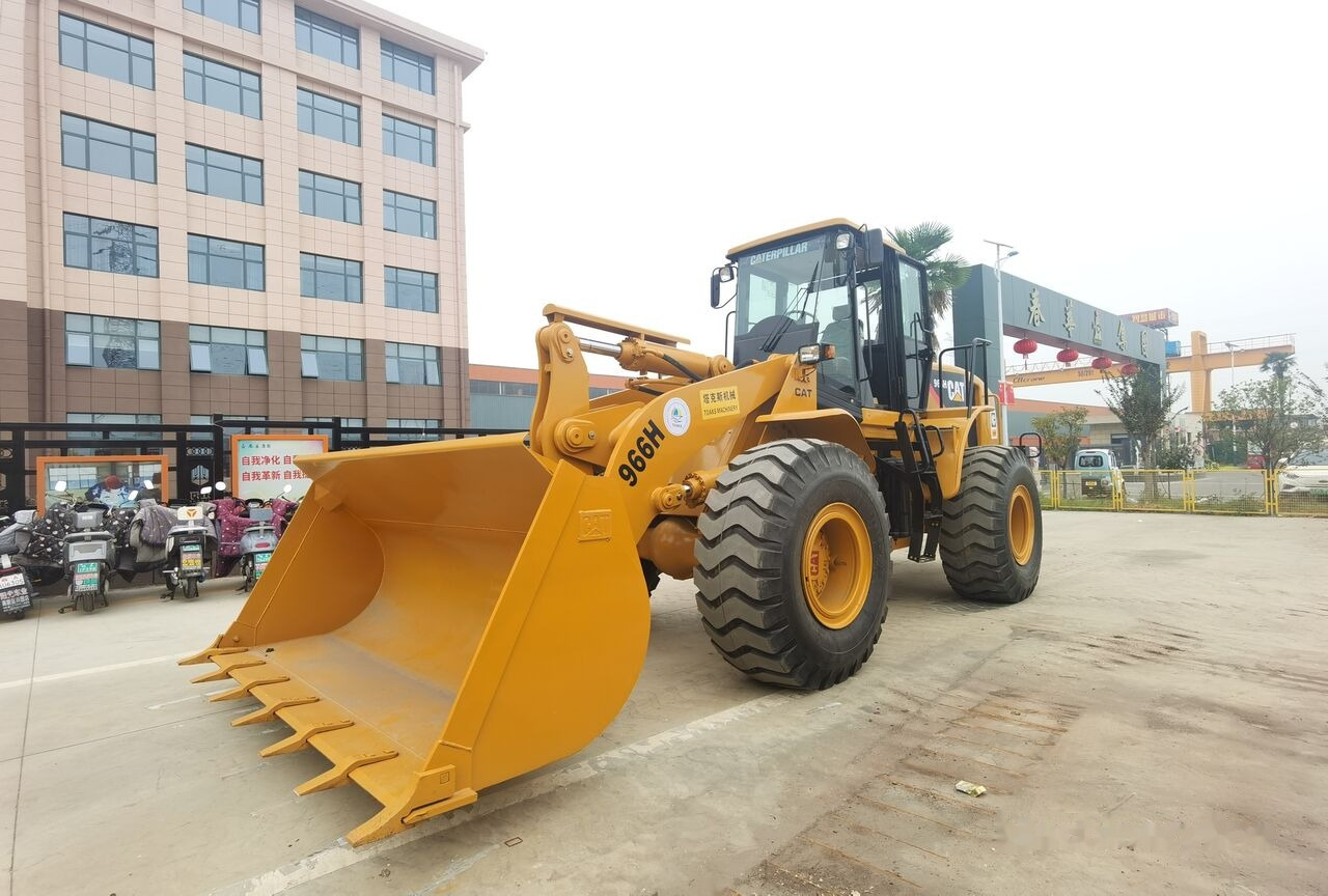 Caterpillar 966H - Utovarivač na kotačima: slika Caterpillar 966H - Utovarivač na kotačima Caterpillar 966H - Utovarivač na kotačima: slika Caterpillar 966H - Utovarivač na kotačima