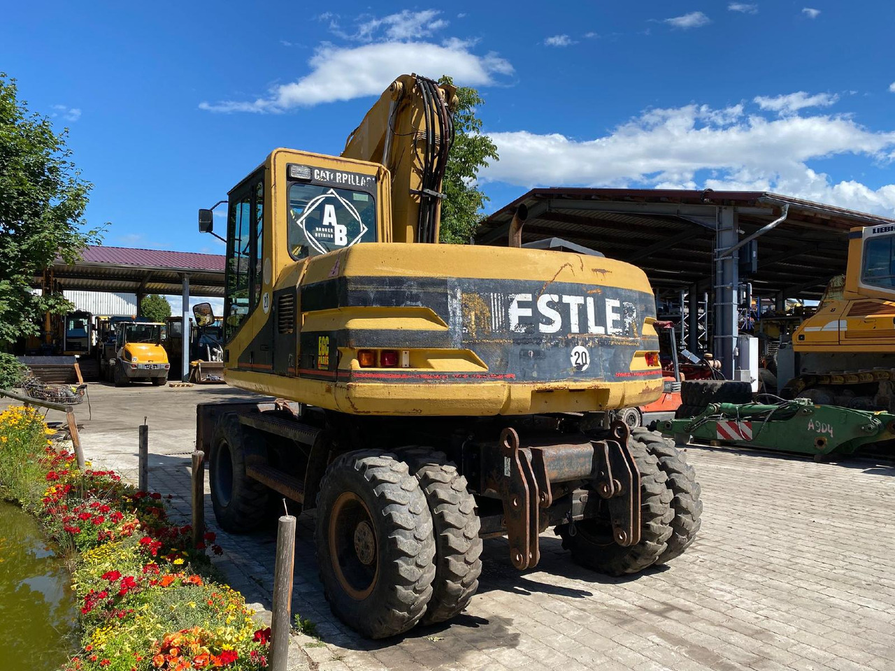 Caterpillar M 312 - Bager na kotačima: slika Caterpillar M 312 - Bager na kotačima Caterpillar M 312 - Bager na kotačima: slika Caterpillar M 312 - Bager na kotačima