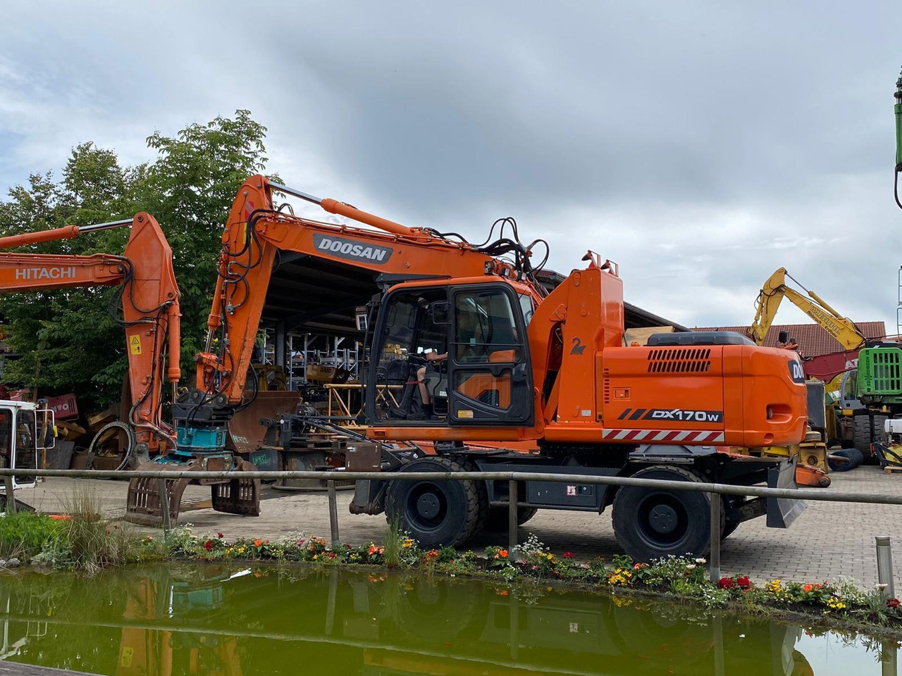 Doosan DX 170 W - Bager na kotačima: slika Doosan DX 170 W - Bager na kotačima Doosan DX 170 W - Bager na kotačima: slika Doosan DX 170 W - Bager na kotačima