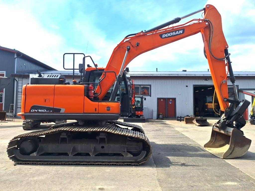 Doosan DX160LCH-5 METSÄMALLI KALLISTAJALLA - Bager gusjeničar: slika Doosan DX160LCH-5 METSÄMALLI KALLISTAJALLA - Bager gusjeničar Doosan DX160LCH-5 METSÄMALLI KALLISTAJALLA - Bager gusjeničar: slika Doosan DX160LCH-5 METSÄMALLI KALLISTAJALLA - Bager gusjeničar