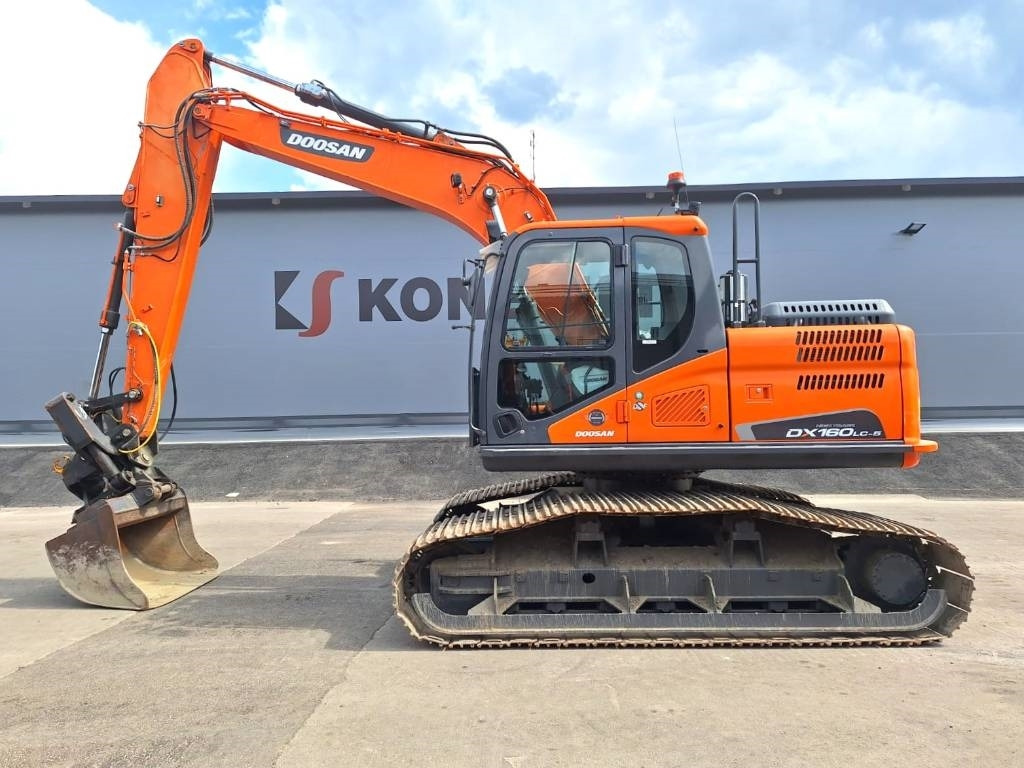 Doosan DX160LCH-5 METSÄMALLI KALLISTAJALLA - Bager gusjeničar: slika Doosan DX160LCH-5 METSÄMALLI KALLISTAJALLA - Bager gusjeničar Doosan DX160LCH-5 METSÄMALLI KALLISTAJALLA - Bager gusjeničar: slika Doosan DX160LCH-5 METSÄMALLI KALLISTAJALLA - Bager gusjeničar