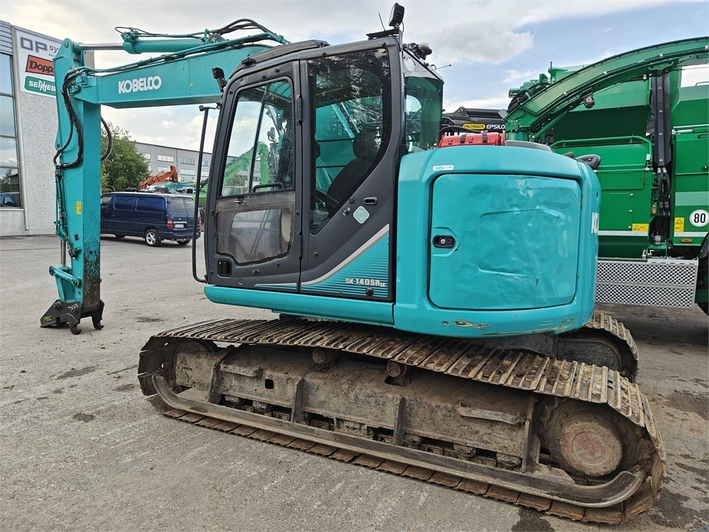 Kobelco SK140SRLC-3 TUKISUKSILLA - Bager gusjeničar: slika Kobelco SK140SRLC-3 TUKISUKSILLA - Bager gusjeničar Kobelco SK140SRLC-3 TUKISUKSILLA - Bager gusjeničar: slika Kobelco SK140SRLC-3 TUKISUKSILLA - Bager gusjeničar