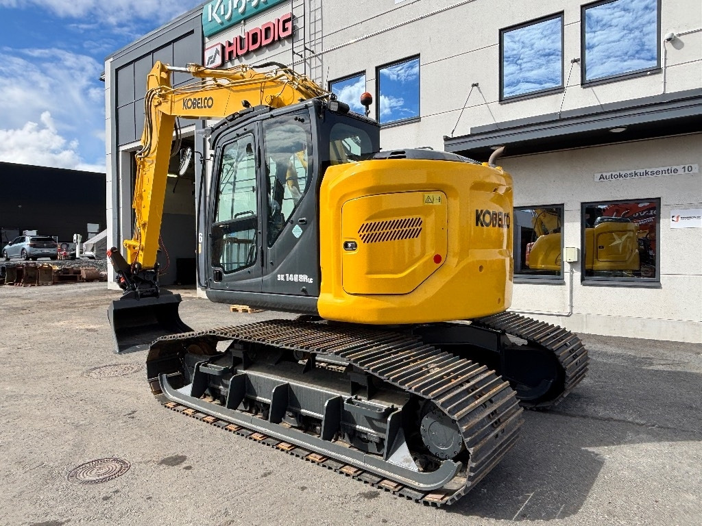Kobelco SK140SRLC-7 KOROTETTU SUOALUSTA 900MM - Bager gusjeničar: slika Kobelco SK140SRLC-7 KOROTETTU SUOALUSTA 900MM - Bager gusjeničar Kobelco SK140SRLC-7 KOROTETTU SUOALUSTA 900MM - Bager gusjeničar: slika Kobelco SK140SRLC-7 KOROTETTU SUOALUSTA 900MM - Bager gusjeničar