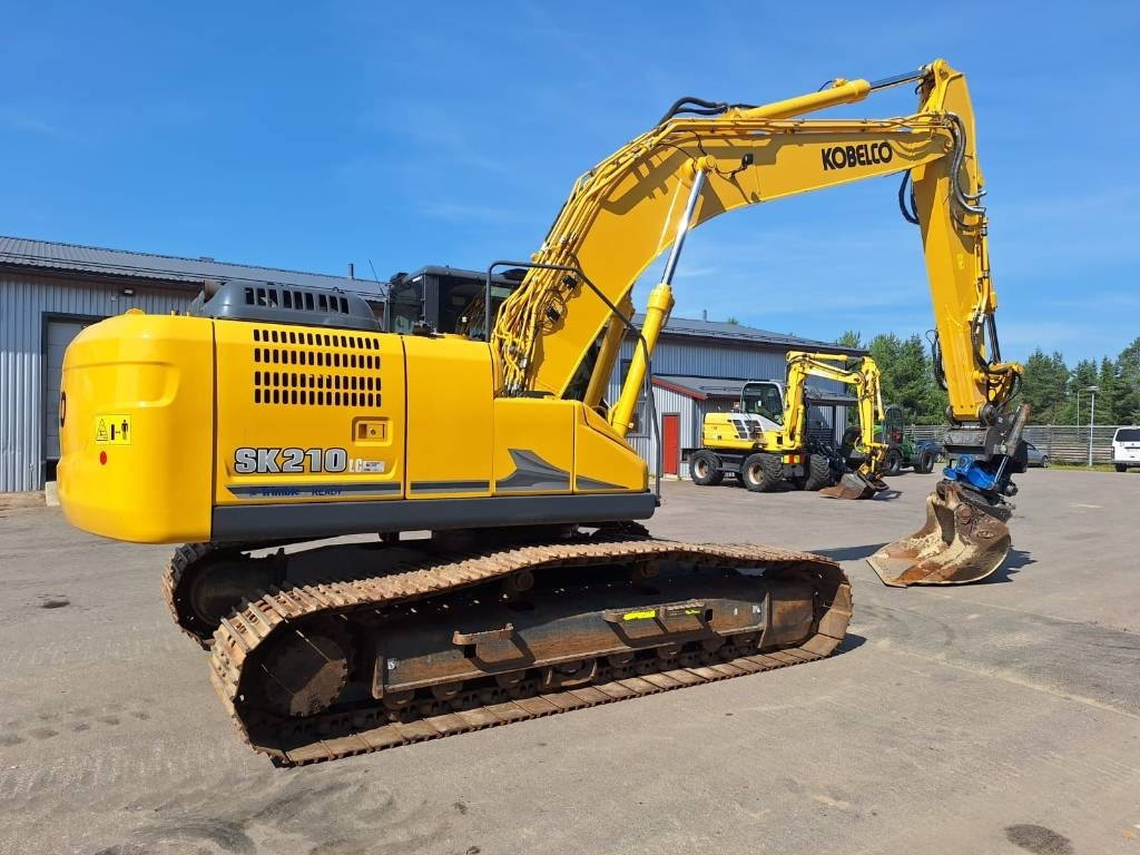 Kobelco SK210LC-11 PYÖRITTÄJÄLLÄ - Bager gusjeničar: slika Kobelco SK210LC-11 PYÖRITTÄJÄLLÄ - Bager gusjeničar Kobelco SK210LC-11 PYÖRITTÄJÄLLÄ - Bager gusjeničar: slika Kobelco SK210LC-11 PYÖRITTÄJÄLLÄ - Bager gusjeničar