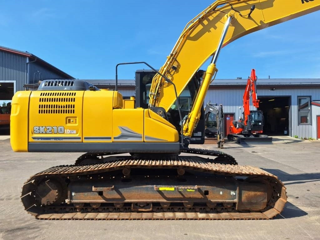 Kobelco SK210LC-11 PYÖRITTÄJÄLLÄ - Bager gusjeničar: slika Kobelco SK210LC-11 PYÖRITTÄJÄLLÄ - Bager gusjeničar Kobelco SK210LC-11 PYÖRITTÄJÄLLÄ - Bager gusjeničar: slika Kobelco SK210LC-11 PYÖRITTÄJÄLLÄ - Bager gusjeničar