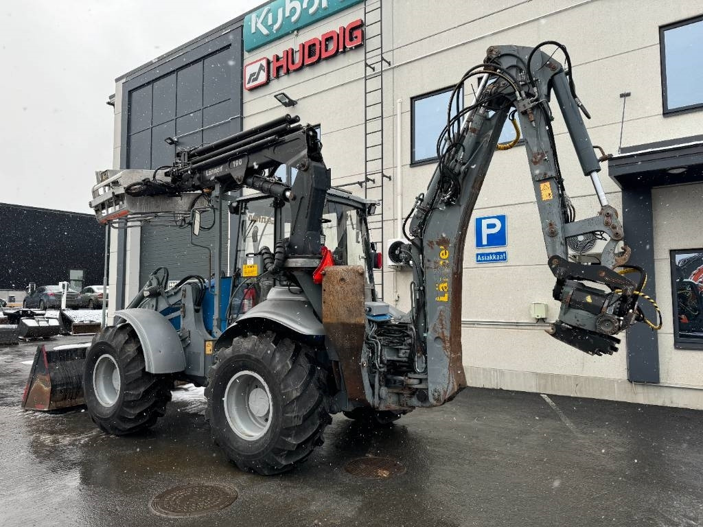 Lännen 8600E PYÖRITTÄJÄ, NOSTIN YM.  - Rovokopač-utovarivač: slika Lännen 8600E PYÖRITTÄJÄ, NOSTIN YM.  - Rovokopač-utovarivač Lännen 8600E PYÖRITTÄJÄ, NOSTIN YM.  - Rovokopač-utovarivač: slika Lännen 8600E PYÖRITTÄJÄ, NOSTIN YM.  - Rovokopač-utovarivač