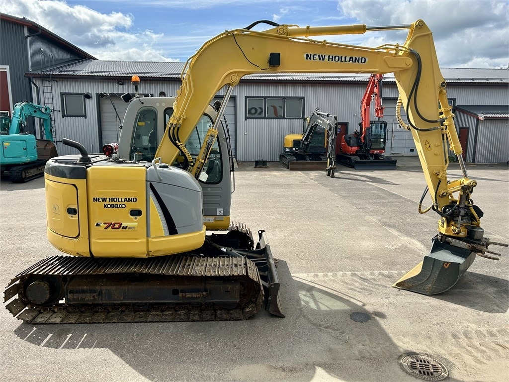 New Holland E 70BSR 2D MITTALAITTEET - Mini bager: slika New Holland E 70BSR 2D MITTALAITTEET - Mini bager New Holland E 70BSR 2D MITTALAITTEET - Mini bager: slika New Holland E 70BSR 2D MITTALAITTEET - Mini bager