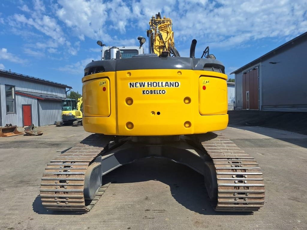 New Holland E235BSRLC PYÖRITTÄJÄLLÄ - Bager gusjeničar: slika New Holland E235BSRLC PYÖRITTÄJÄLLÄ - Bager gusjeničar New Holland E235BSRLC PYÖRITTÄJÄLLÄ - Bager gusjeničar: slika New Holland E235BSRLC PYÖRITTÄJÄLLÄ - Bager gusjeničar