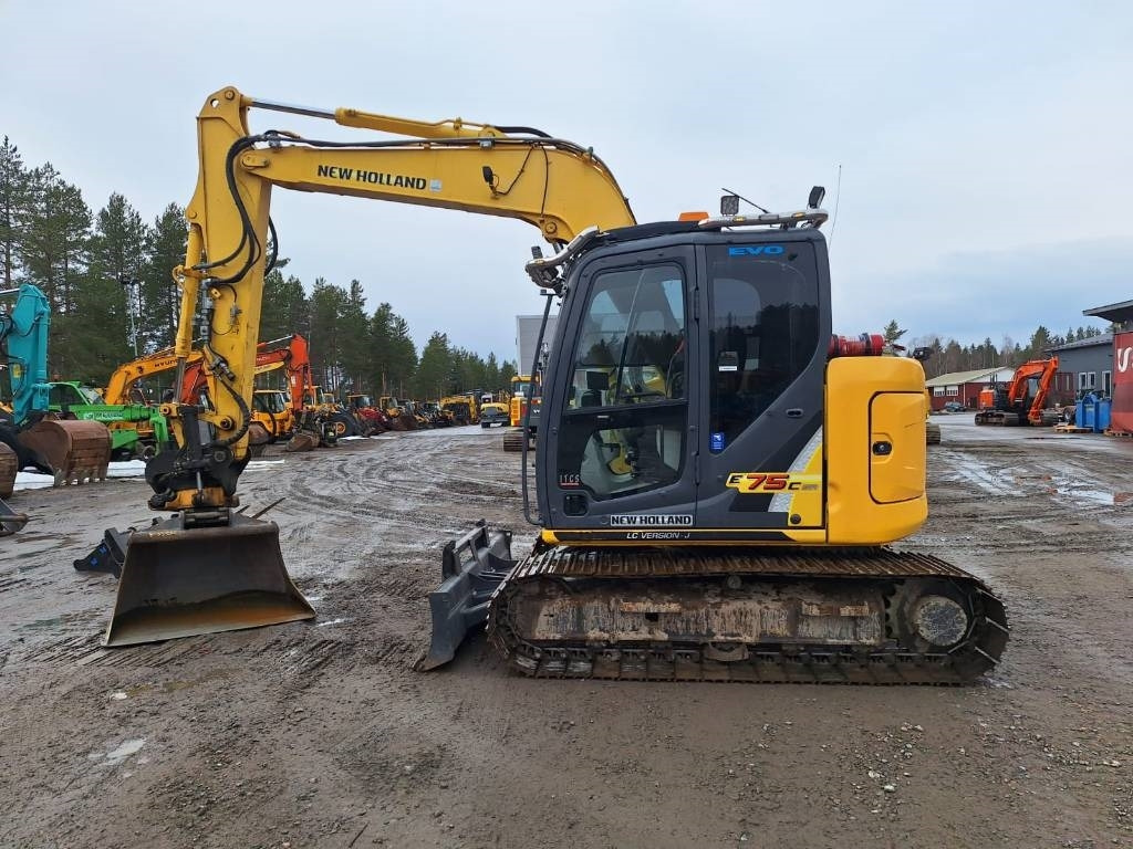 New Holland E75CSR PYÖRITTÄJÄ, 600MM TELAT - Mini bager: slika New Holland E75CSR PYÖRITTÄJÄ, 600MM TELAT - Mini bager New Holland E75CSR PYÖRITTÄJÄ, 600MM TELAT - Mini bager: slika New Holland E75CSR PYÖRITTÄJÄ, 600MM TELAT - Mini bager