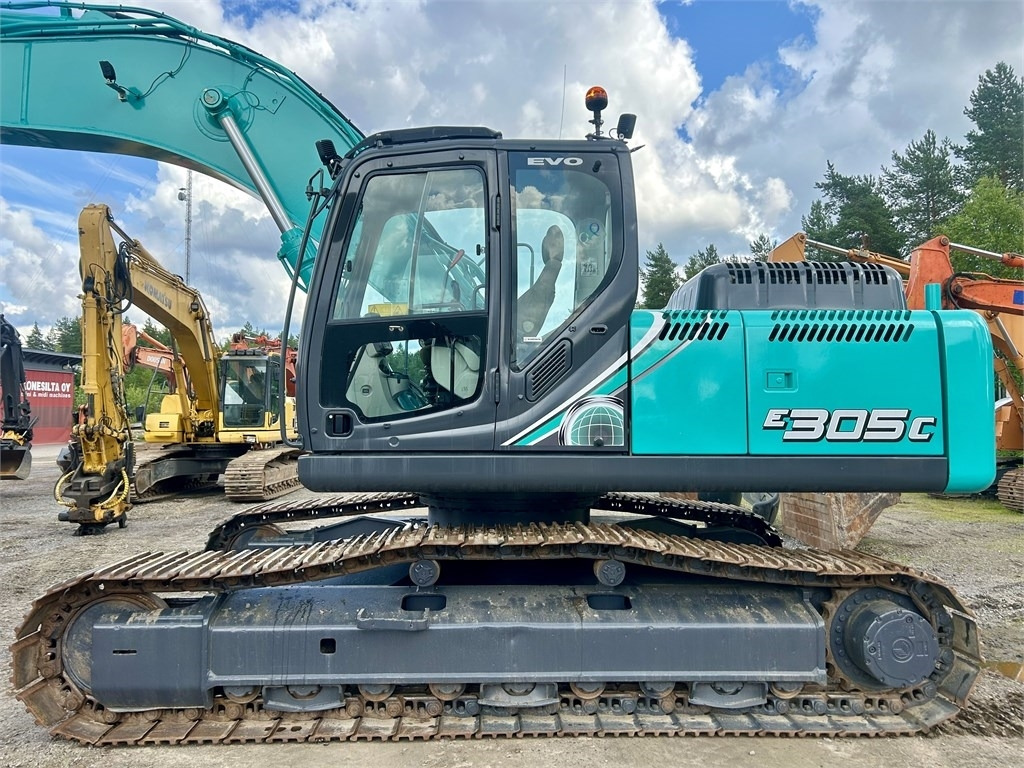 New Holland Kobelco E305C EVO - Bager gusjeničar: slika New Holland Kobelco E305C EVO - Bager gusjeničar New Holland Kobelco E305C EVO - Bager gusjeničar: slika New Holland Kobelco E305C EVO - Bager gusjeničar