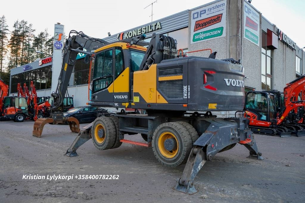 Volvo EW 200 E MH - Stroj za rukovanje otpadom: slika Volvo EW 200 E MH - Stroj za rukovanje otpadom Volvo EW 200 E MH - Stroj za rukovanje otpadom: slika Volvo EW 200 E MH - Stroj za rukovanje otpadom