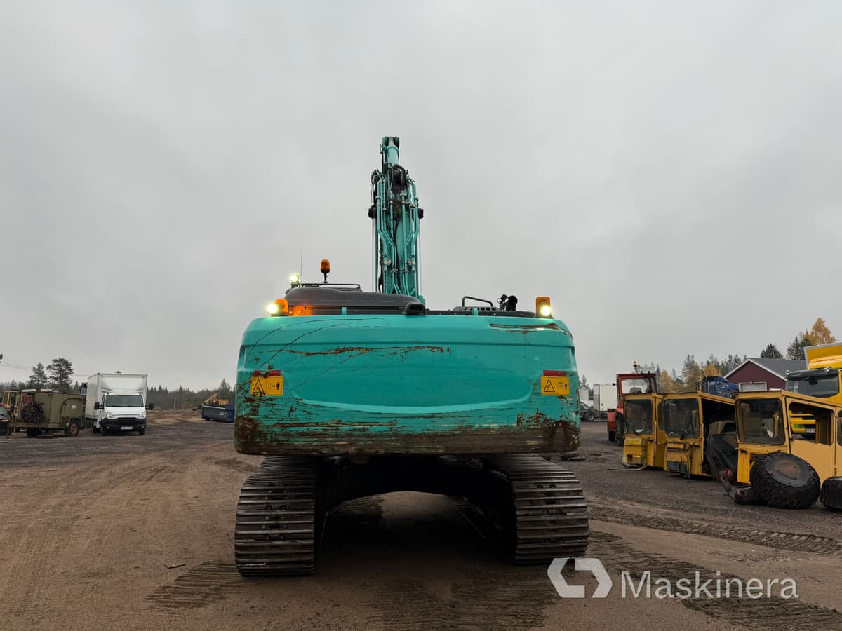 Grävmaskin Kobelco SK350LC-10 med stålsax - Bager gusjeničar: slika Grävmaskin Kobelco SK350LC-10 med stålsax - Bager gusjeničar Grävmaskin Kobelco SK350LC-10 med stålsax - Bager gusjeničar: slika Grävmaskin Kobelco SK350LC-10 med stålsax - Bager gusjeničar
