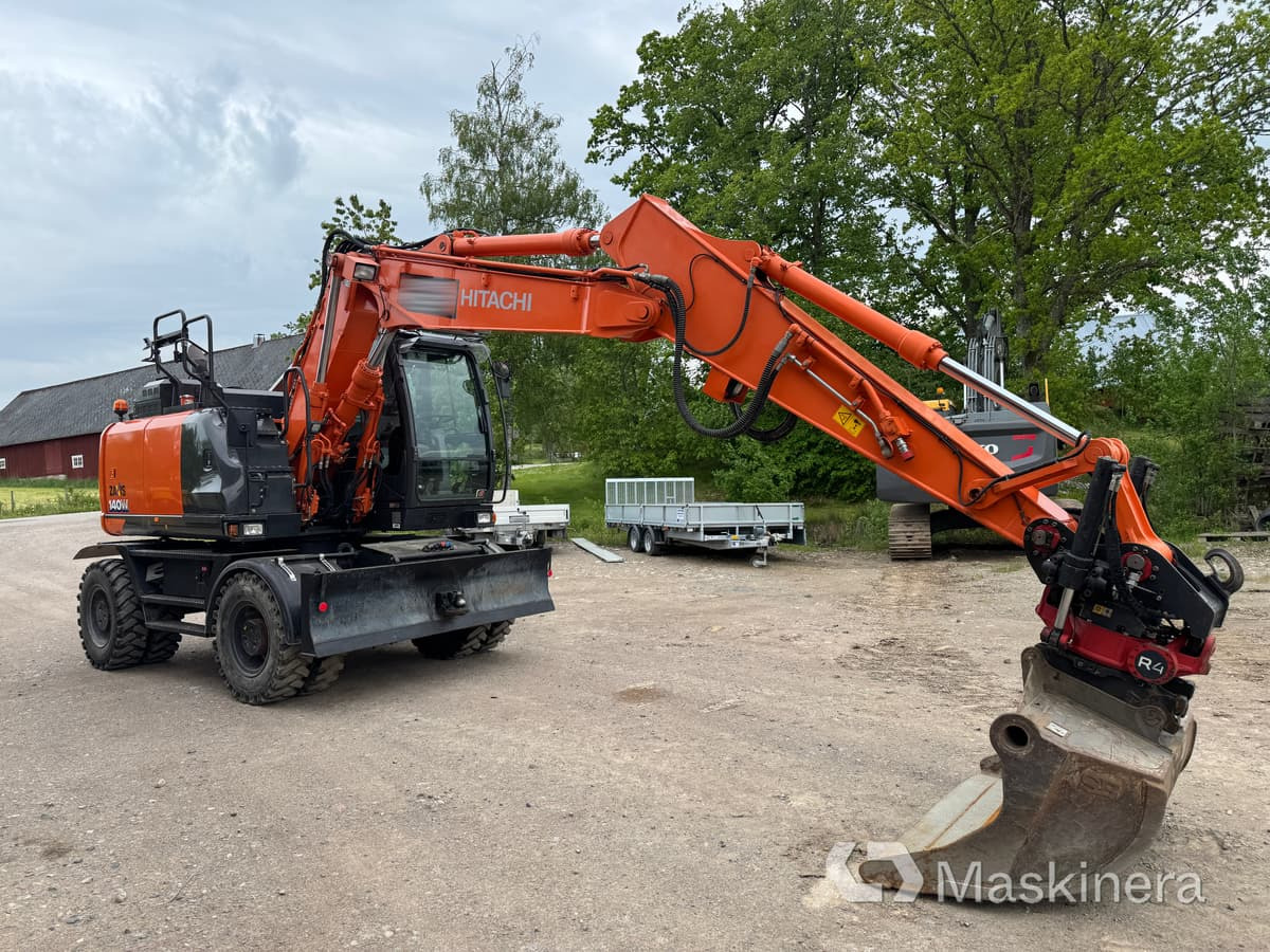 Hjulgrävare Hitachi Zaxis 140W med redskap - Bager gusjeničar: slika Hjulgrävare Hitachi Zaxis 140W med redskap - Bager gusjeničar Hjulgrävare Hitachi Zaxis 140W med redskap - Bager gusjeničar: slika Hjulgrävare Hitachi Zaxis 140W med redskap - Bager gusjeničar