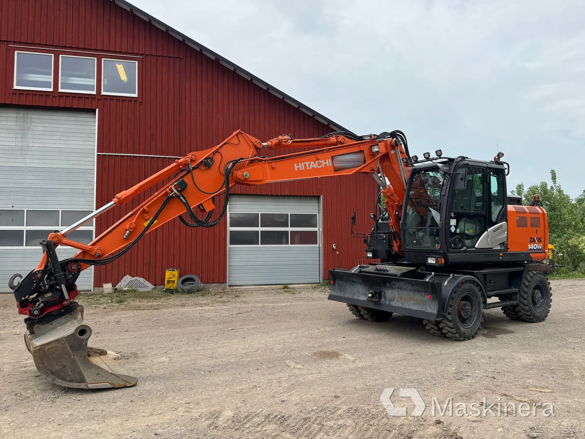 Hjulgrävare Hitachi Zaxis 140W med redskap - Bager gusjeničar: slika Hjulgrävare Hitachi Zaxis 140W med redskap - Bager gusjeničar Hjulgrävare Hitachi Zaxis 140W med redskap - Bager gusjeničar: slika Hjulgrävare Hitachi Zaxis 140W med redskap - Bager gusjeničar
