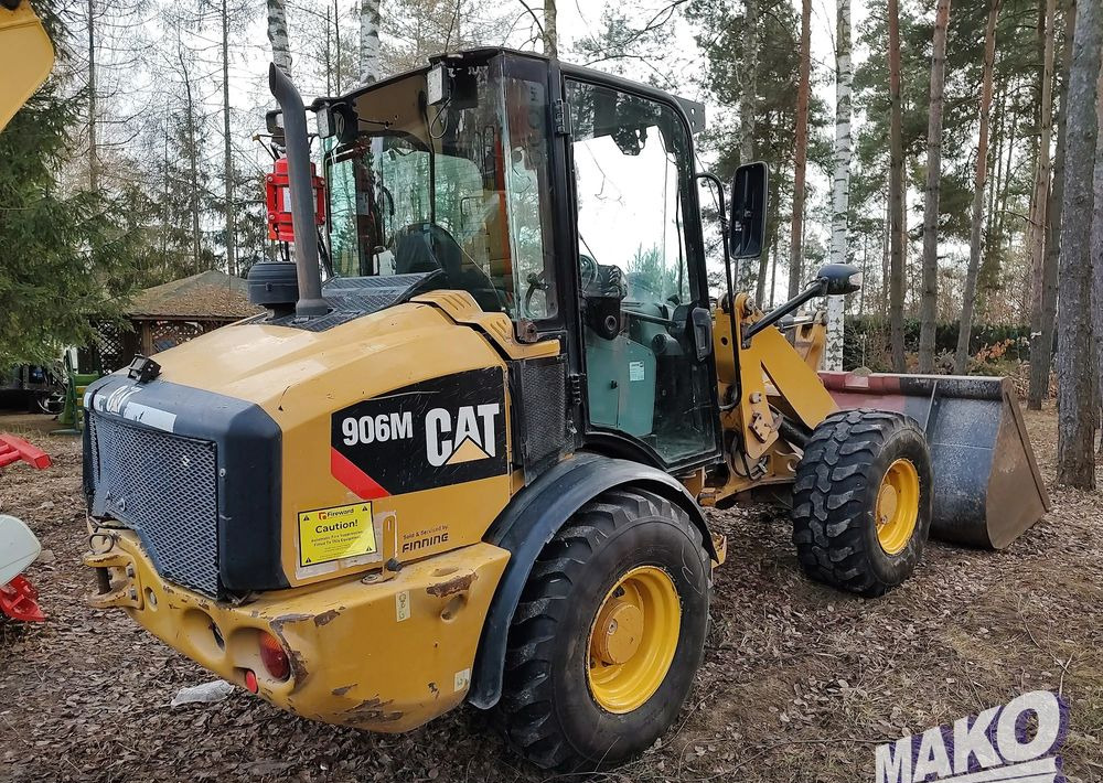 Caterpillar 906M - Utovarivač na kotačima: slika Caterpillar 906M - Utovarivač na kotačima Caterpillar 906M - Utovarivač na kotačima: slika Caterpillar 906M - Utovarivač na kotačima