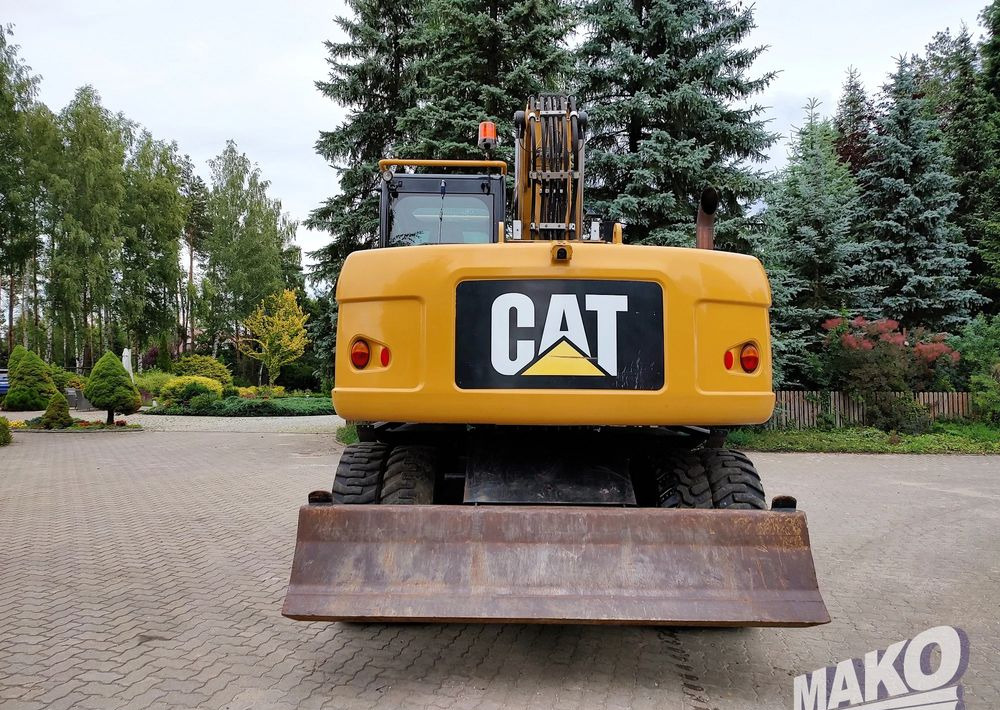 Caterpillar M313D - Bager na kotačima: slika Caterpillar M313D - Bager na kotačima Caterpillar M313D - Bager na kotačima: slika Caterpillar M313D - Bager na kotačima