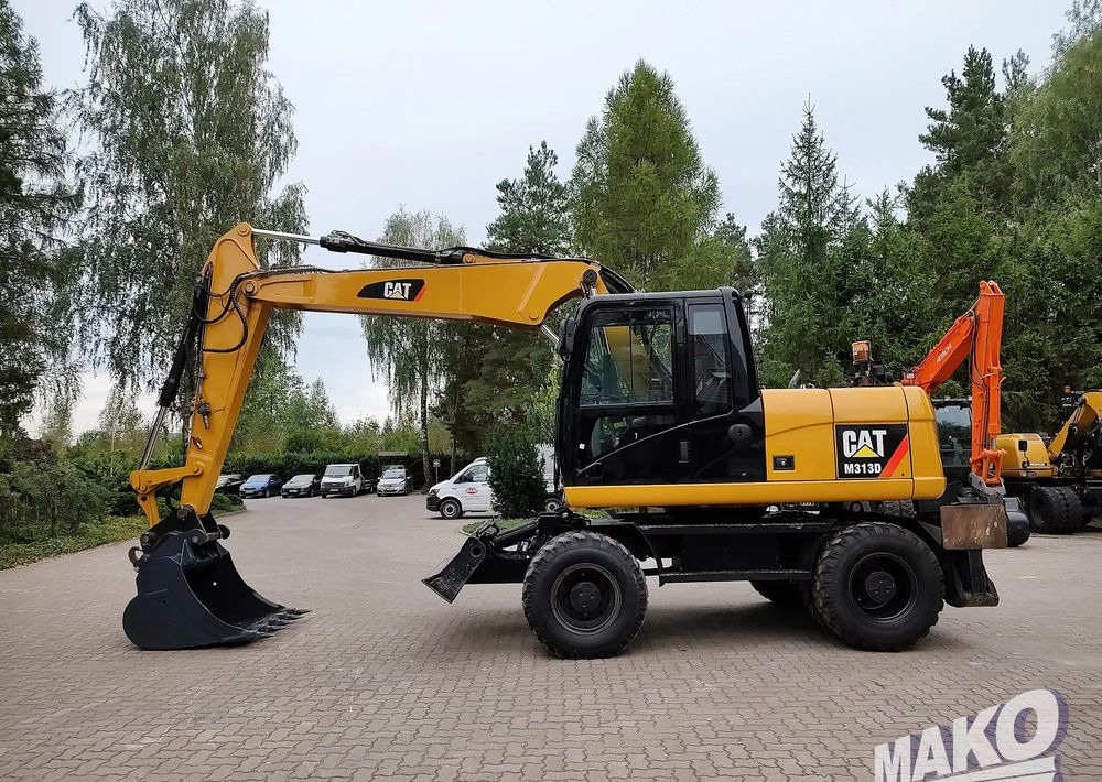 Caterpillar M313D - Bager na kotačima: slika Caterpillar M313D - Bager na kotačima Caterpillar M313D - Bager na kotačima: slika Caterpillar M313D - Bager na kotačima