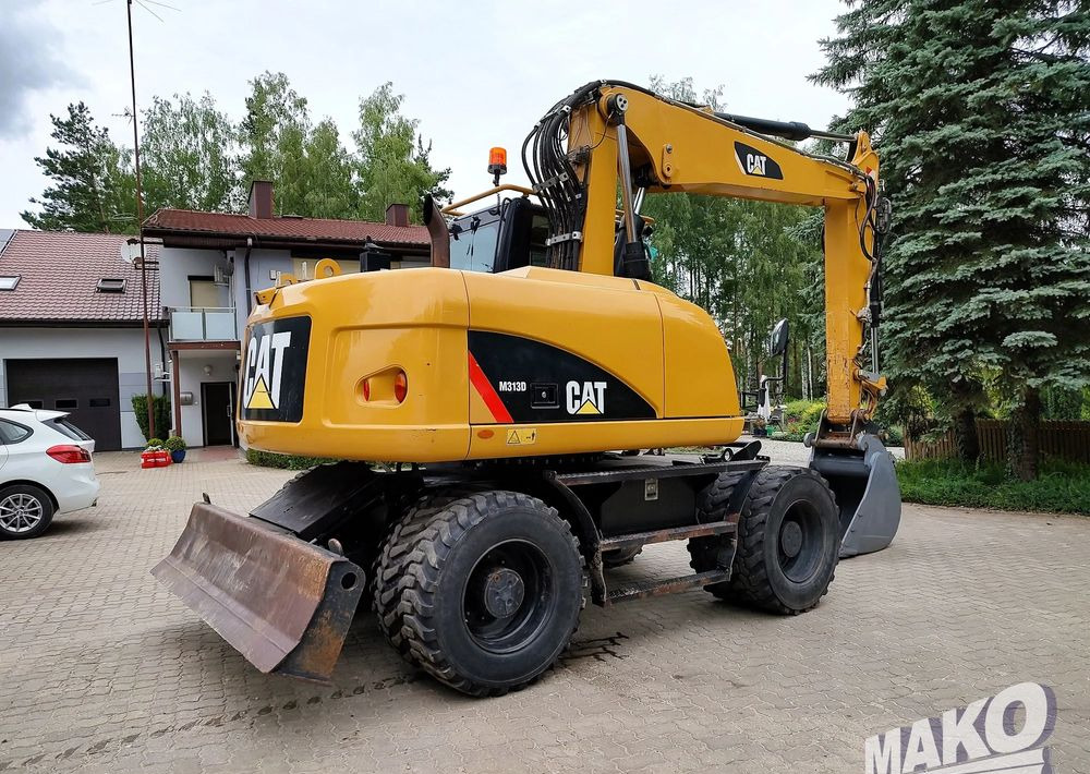 Caterpillar M313D - Bager na kotačima: slika Caterpillar M313D - Bager na kotačima Caterpillar M313D - Bager na kotačima: slika Caterpillar M313D - Bager na kotačima
