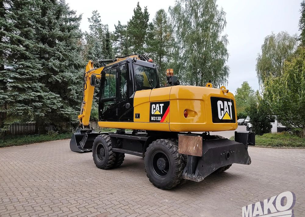 Caterpillar M313D - Bager na kotačima: slika Caterpillar M313D - Bager na kotačima Caterpillar M313D - Bager na kotačima: slika Caterpillar M313D - Bager na kotačima