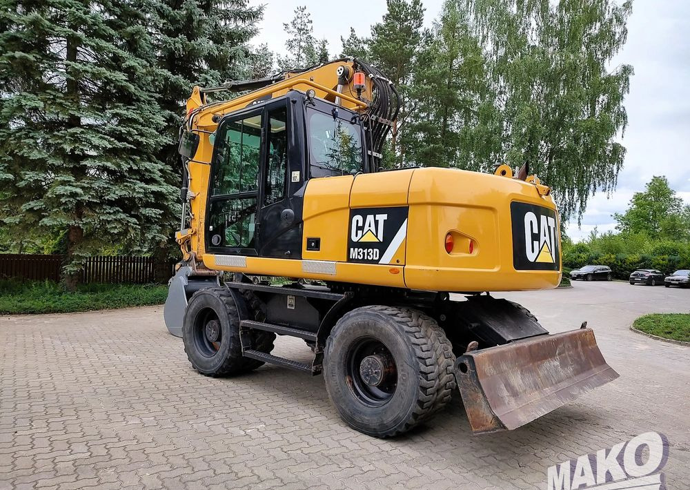 Caterpillar M313D - Bager na kotačima: slika Caterpillar M313D - Bager na kotačima Caterpillar M313D - Bager na kotačima: slika Caterpillar M313D - Bager na kotačima