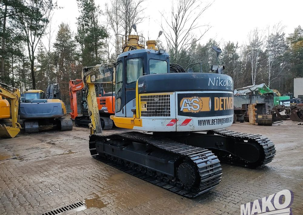 Komatsu PC228USLC-3 - Bager gusjeničar: slika Komatsu PC228USLC-3 - Bager gusjeničar Komatsu PC228USLC-3 - Bager gusjeničar: slika Komatsu PC228USLC-3 - Bager gusjeničar