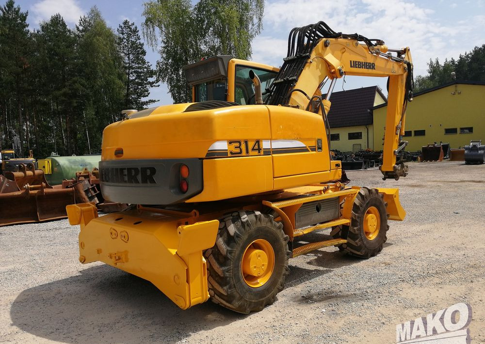 Liebherr A 314 Litronic - Bager na kotačima: slika Liebherr A 314 Litronic - Bager na kotačima Liebherr A 314 Litronic - Bager na kotačima: slika Liebherr A 314 Litronic - Bager na kotačima