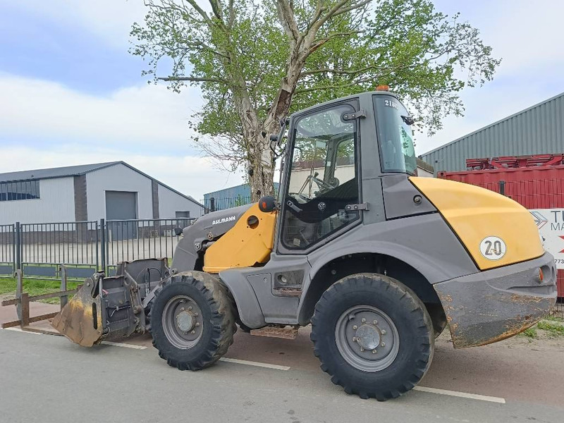 Ahlmann AS 700 wiellader shovel loader lader bak+vorken - Utovarivač na kotačima: slika Ahlmann AS 700 wiellader shovel loader lader bak+vorken - Utovarivač na kotačima Ahlmann AS 700 wiellader shovel loader lader bak+vorken - Utovarivač na kotačima: slika Ahlmann AS 700 wiellader shovel loader lader bak+vorken - Utovarivač na kotačima