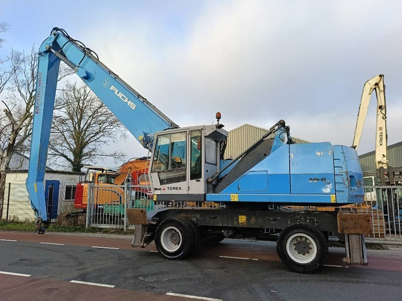 Fuchs MHL 350 industry waste handler umslagbagger - Stroj za rukovanje otpadom: slika Fuchs MHL 350 industry waste handler umslagbagger - Stroj za rukovanje otpadom Fuchs MHL 350 industry waste handler umslagbagger - Stroj za rukovanje otpadom: slika Fuchs MHL 350 industry waste handler umslagbagger - Stroj za rukovanje otpadom