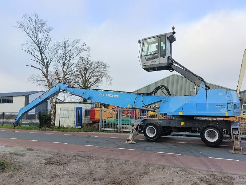 Fuchs MHL 350 industry waste handler umslagbagger - Stroj za rukovanje otpadom: slika Fuchs MHL 350 industry waste handler umslagbagger - Stroj za rukovanje otpadom Fuchs MHL 350 industry waste handler umslagbagger - Stroj za rukovanje otpadom: slika Fuchs MHL 350 industry waste handler umslagbagger - Stroj za rukovanje otpadom