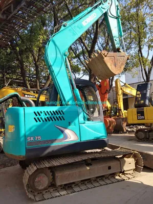 Second Hand Mini Hydraulic Excavator Kobelco Sk75 Excavator with Blade for Sale - Bager gusjeničar: slika Second Hand Mini Hydraulic Excavator Kobelco Sk75 Excavator with Blade for Sale - Bager gusjeničar Second Hand Mini Hydraulic Excavator Kobelco Sk75 Excavator with Blade for Sale - Bager gusjeničar: slika Second Hand Mini Hydraulic Excavator Kobelco Sk75 Excavator with Blade for Sale - Bager gusjeničar