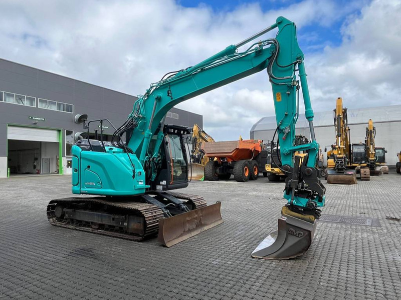 Kobelco SK 140 SR LC - 7 - Bager gusjeničar: slika Kobelco SK 140 SR LC - 7 - Bager gusjeničar Kobelco SK 140 SR LC - 7 - Bager gusjeničar: slika Kobelco SK 140 SR LC - 7 - Bager gusjeničar