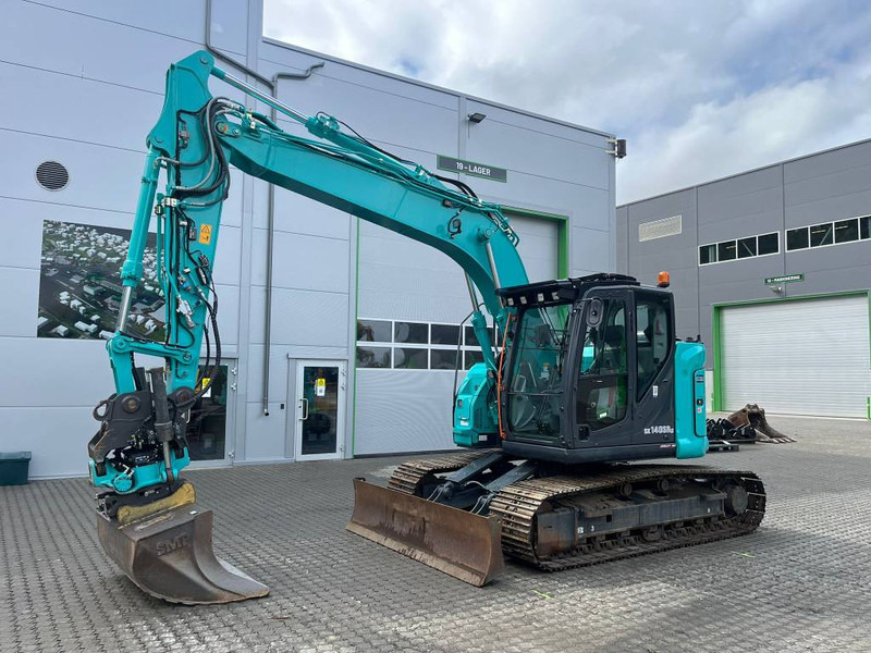 Kobelco SK 140 SR LC - 7 - Bager gusjeničar: slika Kobelco SK 140 SR LC - 7 - Bager gusjeničar Kobelco SK 140 SR LC - 7 - Bager gusjeničar: slika Kobelco SK 140 SR LC - 7 - Bager gusjeničar
