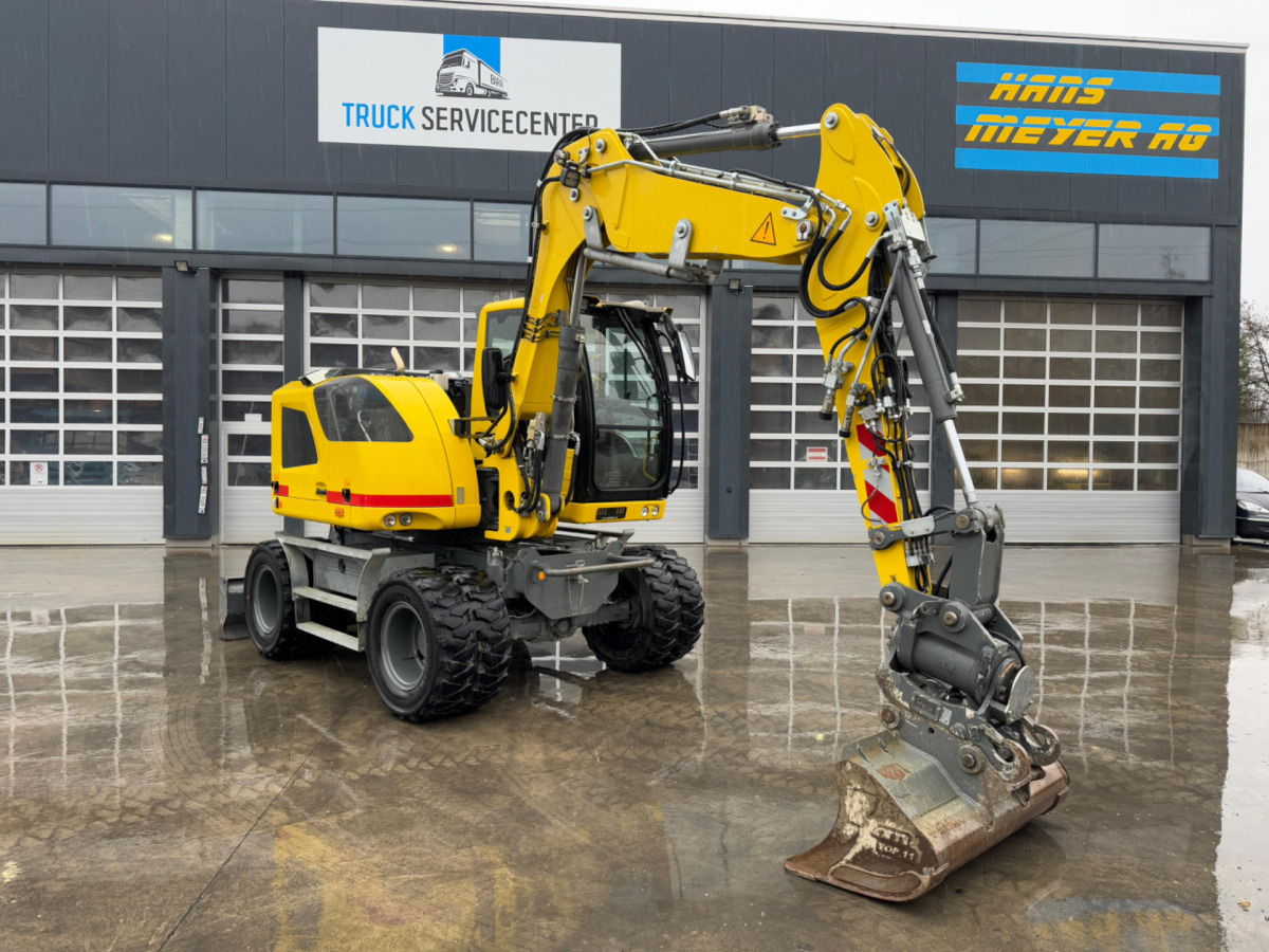 LIEBHERR 910 Compact Litronic Powertilt - Bager na kotačima: slika LIEBHERR 910 Compact Litronic Powertilt - Bager na kotačima LIEBHERR 910 Compact Litronic Powertilt - Bager na kotačima: slika LIEBHERR 910 Compact Litronic Powertilt - Bager na kotačima