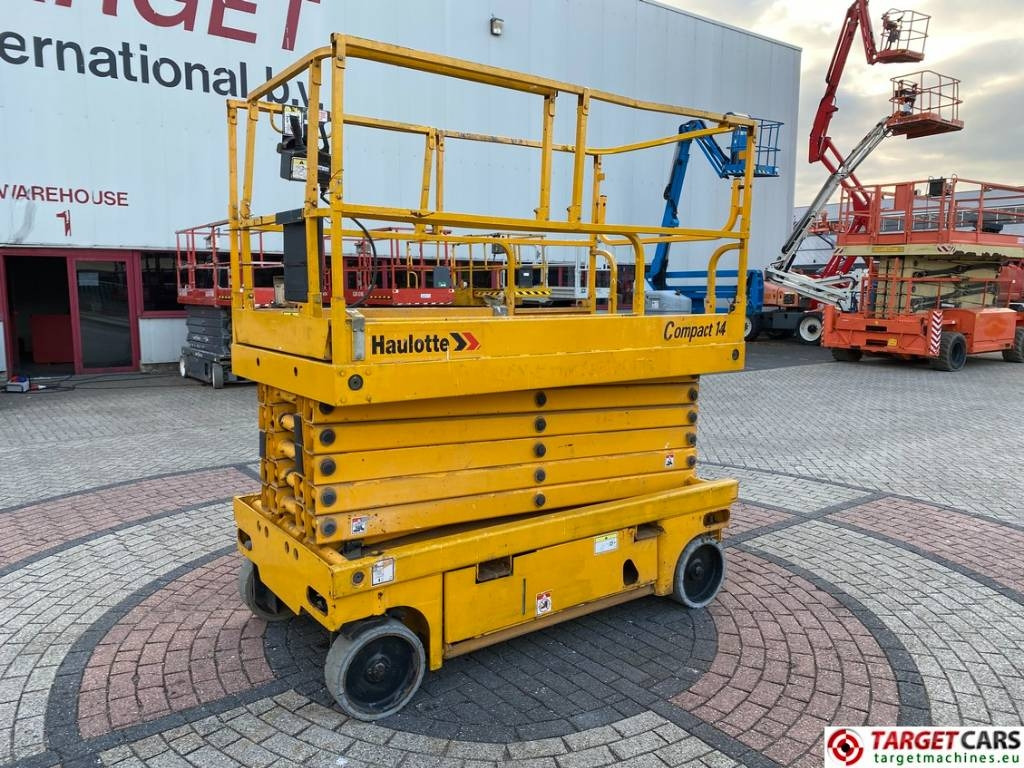 Haulotte Compact 14 Electric Scissor Work Lift 1385cm - Škarasta podizna platforma: slika Haulotte Compact 14 Electric Scissor Work Lift 1385cm - Škarasta podizna platforma Haulotte Compact 14 Electric Scissor Work Lift 1385cm - Škarasta podizna platforma: slika Haulotte Compact 14 Electric Scissor Work Lift 1385cm - Škarasta podizna platforma