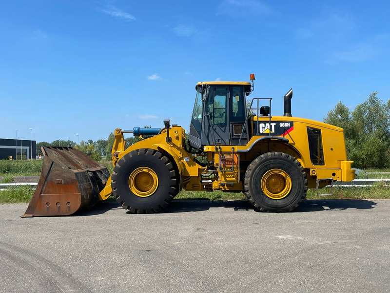 Caterpillar 966H - Utovarivač na kotačima: slika Caterpillar 966H - Utovarivač na kotačima Caterpillar 966H - Utovarivač na kotačima: slika Caterpillar 966H - Utovarivač na kotačima